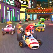 Mario in the B Dasher racing with Princess Peach, Yoshi, Shy Guy and Donkey Kong in Mario Kart Tour.