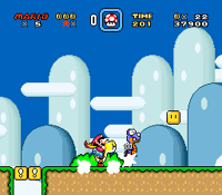 Super Mario World screenshot of Yellow Yoshi defeating a  with sand clouds