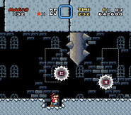 Mario staring up at a Spike Pillar and a Grinder, with another Grinder appearing nearby to the right