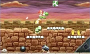 Yoshi above a Kaboomba.