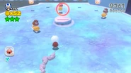 A few Skating Goombas skate towards Tanooki Toad.