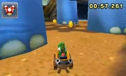 Mario Kart 7 screenshot of Yoshi driving between the dinosaur's legs