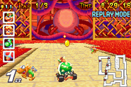 Mario Kart: Super Circuit screenshot of Bowser racing by some Mechakoopas