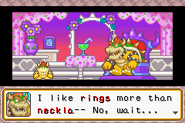 Mario Party Advance screenshot of Bowser in Bowser Pad, giving hints as to which jewelry item is his favorite