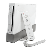 The original Wii model on it's stand with a Wii remote leaning on it.