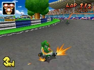 Yoshi powersliding on the track.