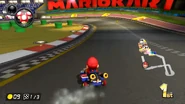 About to drift around the last turn, with some green Pipes on the dirt.