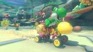 Yoshi on the Wild Wiggler, racing with Donkey Kong and Toad