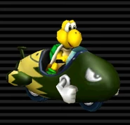 Koopa Troopa's Bullet Bike has a dark green complexion with a yellow rear.