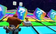Lakitu and Donkey Kong racing on the track.