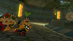 Iggy and Bowser race inside one of the track's tunnels.