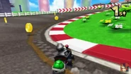 Metal Mario drifting around the second turn.