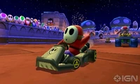  racing through the track in Mario Kart 7.