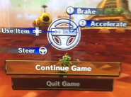 Bowser Jr. racing on Maple Treeway passing a Wiggler.