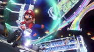 Mario racing in Mario Kart 8's Rainbow Road.