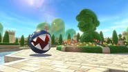 Pre-release screenshot of the Mario topiary in Mario Kart 8 Deluxe, without the newly added barriers.