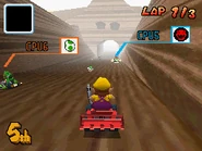 Wario racing at N64 Choco Mountain in his Dragonfly.