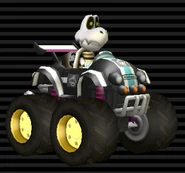 Dry Bones' Tiny Titan, black with white stripes, black emblem, light blue stripe through, tires are tinted brown-red.