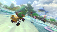 Gloriously racing along with a Dolphin, Yoshi performs an amazing Jump Boost in Dolphin Shoals.