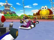 Wario and Toad in the track racing.