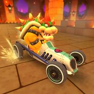 Bowser racing at GBA Bowser Castle 1 in Mario Kart Tour.