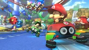 Baby Mario, Baby Luigi, and Baby Peach, racing along the track.