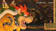 Mario vecht met Bowser in New Super Mario Bros. Wii.