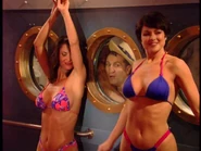 As one of the sexy partygoers dancing near Al's window in "Ship Happens (Part 1)". (right, in the solid color bikini)