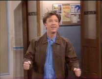 Polk high 2.png (2.33 MB) Bud in front of the door leading to the auditorium