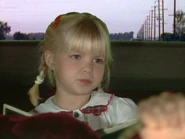 Young kelly bundy rfac 1.png (1.42 MB) Kelly at 3-4 years old in "Requiem for a Chevyweight (Part 1)" (played by Hannah Swanson)