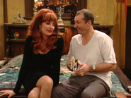 Al holding a TV Guide that Peg got for him in "Breaking Up is Easy to Do (Part 3)".
