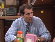 Tri-c 2.png (1.41 MB) Al sitting at the table with a bottle of Tri-C in season 1's "Nightmare on Al's Street"