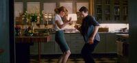 Mary Jane Watson is dansing with Harry Osborn Earth-86283