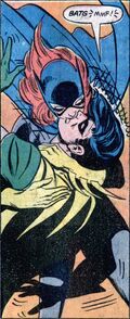 Batgirl kisses Robin