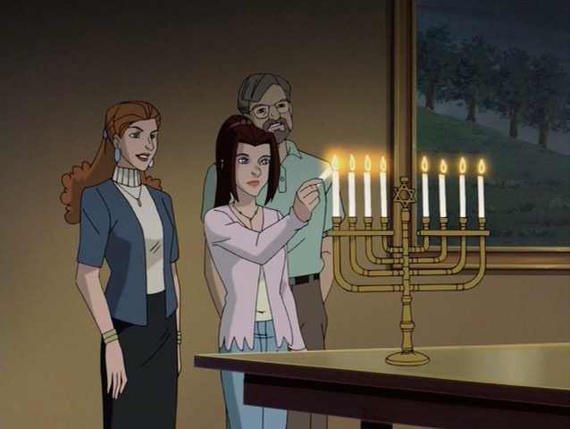 The Pryde Family lighting their menorah