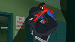 Spider-Man plunges the gene cleanser down Venom's throat