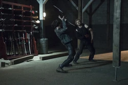 Scythe attempting to slash at the 