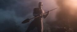  plunges his spear into the ground