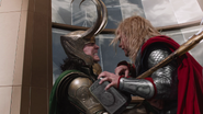 Loki stabs Thor