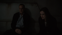 Coulson and Simmons in the room