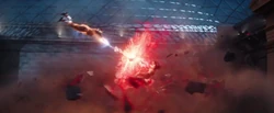 Captain Marvel firing a photon blast at 