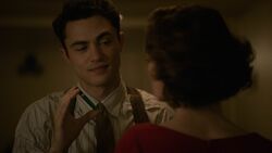 Malick holding the  vial