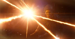 The glaive deflects a blast from the 