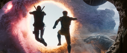 Deadpool and Wolverine jumping into a portal