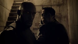 Zhi is interrogated by 