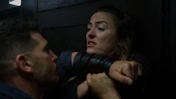  pinning a mercenary to a wall