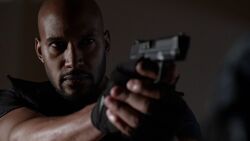 Mackenzie points his gun at 