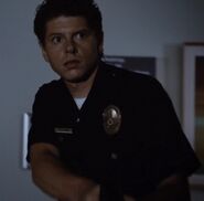 Unknown actor as Hospital Guard #1