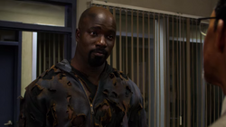 Luke Cage talking with police captain