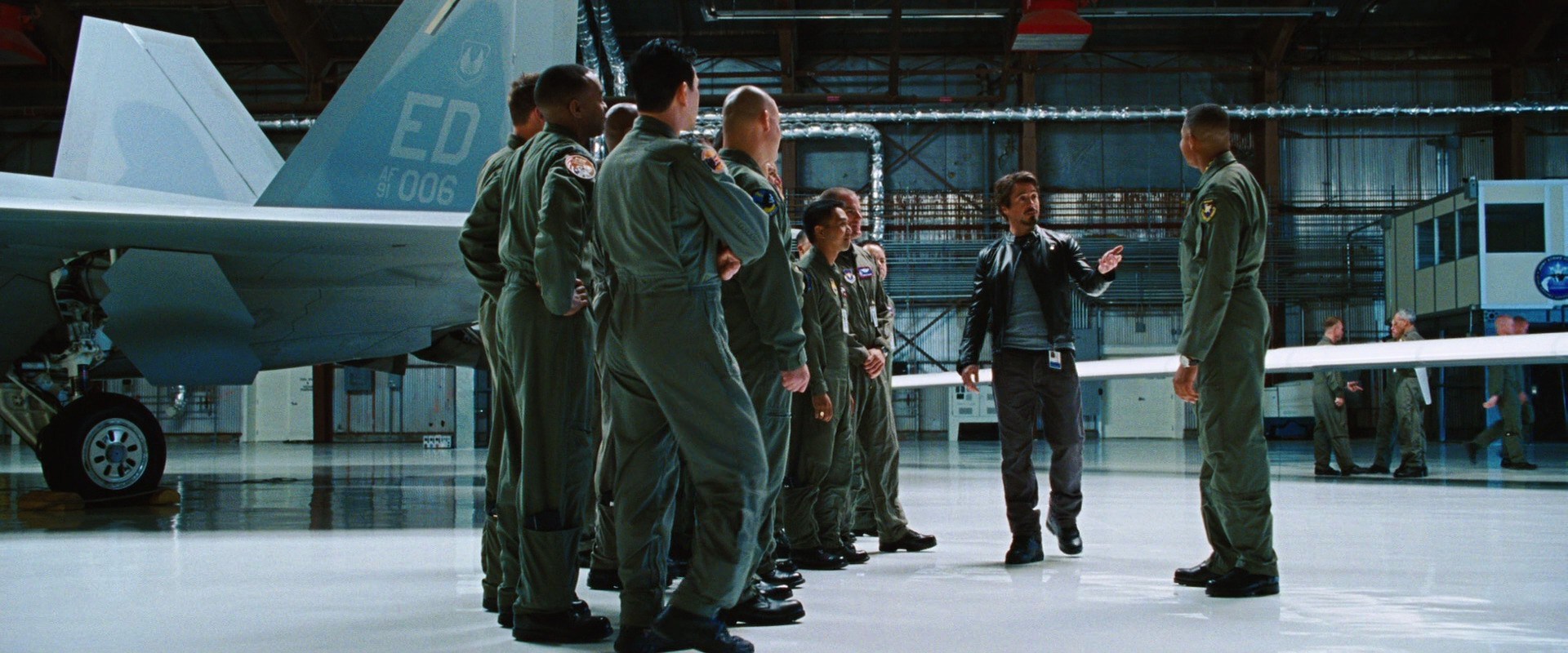 In Iron Man 2 War Machine has ED 445 FLTS on his shoulder. This is the  tail code for the 445th Flight Test Squadron out of Edwards Air Force Base,  which is